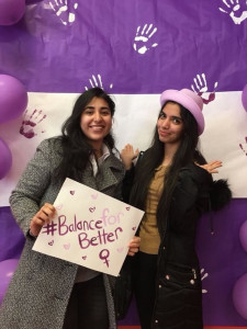 Two girls with poster for balance for better