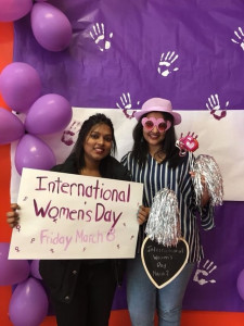 two girls with poster