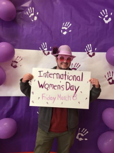 Boy with poster for International women's day