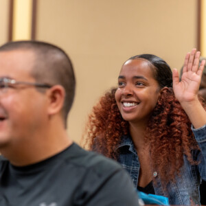 A student raising hand during lecture