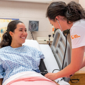 Nursing student with patient